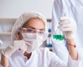 Young woman chemist working in clinic lab