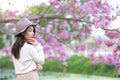 Young woman with cherry blossom garden in Spring day Royalty Free Stock Photo