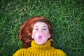 Young Woman Chewing Gum And Making Big Balloon Royalty Free Stock Photo