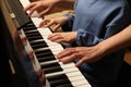 Young woman with child playing piano, closeup. Music lesson Royalty Free Stock Photo