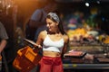 Young woman chooses meat in a grocery store Royalty Free Stock Photo