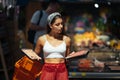 Young woman chooses meat in a grocery store Royalty Free Stock Photo