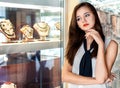 Young woman choosing jewelry in shop Royalty Free Stock Photo