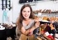 Young woman choosing shoes in store . Royalty Free Stock Photo
