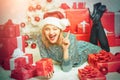 Young woman with Christmas present boxes in front of Christmas tree. New year eve girl. Beautiful Woman with Christmas Royalty Free Stock Photo