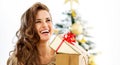 Young woman with christmas present boxes in front of Royalty Free Stock Photo