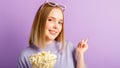 Young woman in cinema glasses watching 3d movie. Smiling teenager girl movie viewer in glasses with popcorn show with Royalty Free Stock Photo