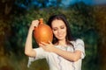 Young Woman with Clay Pitcher Royalty Free Stock Photo