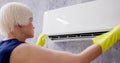 Young Woman Cleaning Air Conditioning System Royalty Free Stock Photo