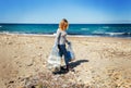 Young woman cleaning beach area from plastic Royalty Free Stock Photo