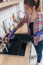 Young woman cleaning countertop in the kitchen Royalty Free Stock Photo