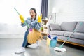 Young woman cleaning floor at home doing chores. She had enjoying domestic duties Royalty Free Stock Photo