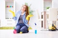 The young woman cleaning floor at home doing chores Royalty Free Stock Photo