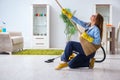 The young woman cleaning floor at home doing chores Royalty Free Stock Photo