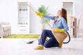 The young woman cleaning floor at home doing chores Royalty Free Stock Photo