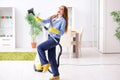 The young woman cleaning floor at home doing chores Royalty Free Stock Photo