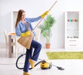 Young woman cleaning floor at home doing chores Royalty Free Stock Photo