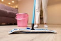 young woman mopping floor at living room Royalty Free Stock Photo