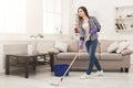 Young woman cleaning house with mop Royalty Free Stock Photo