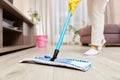 young woman mopping floor at living room Royalty Free Stock Photo