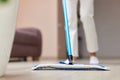 young woman mopping floor at living room Royalty Free Stock Photo