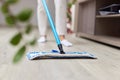 young woman mopping floor at living room Royalty Free Stock Photo