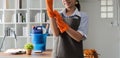 Young woman cleaning to disinfect computer and equipment on office table Cleaning staff or maid cleaning the office Royalty Free Stock Photo