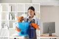 Young woman cleaning to disinfect computer and equipment on office table Cleaning staff or maid cleaning the office Royalty Free Stock Photo