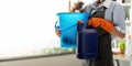 Young woman cleaning to disinfect the office office cleaning staff cleaning maid. Female cleaner holding a bucket with Royalty Free Stock Photo