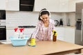 young woman cleaning wooden table with microfiber cloth. Royalty Free Stock Photo