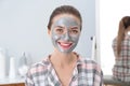 Young woman with cleansing mask on her face. Skin care Royalty Free Stock Photo