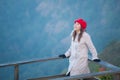 Young woman on a cliff overlooking the mountains Royalty Free Stock Photo