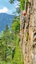 Young woman climber on via ferrata, Alps, Austria