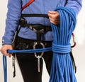 Young woman in climbing equipment on white background Royalty Free Stock Photo