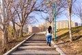 Young woman climbing stairs in a park Royalty Free Stock Photo