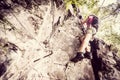 Young woman climbing on via ferrata