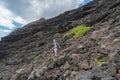 A Young Woman Climbs Down a Cliff on Oahu to Reach Tidal Pools