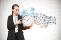 Young woman with clock and business plan sketch Royalty Free Stock Photo