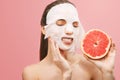 Woman Removes a Cleansing Mask Royalty Free Stock Photo