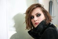 Young woman in coat with dark smoky eyes makeup Royalty Free Stock Photo