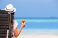 Young woman with cocktail glass near swimming pool Royalty Free Stock Photo