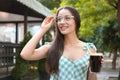 Young woman with cold kvass outdoors. Traditional Russian summer drink