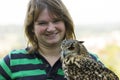 Young woman with collared Scops Owl