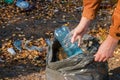 Young woman collects garbage