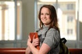 Young Woman College Student holding a book