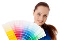 Young woman with a color guide. Royalty Free Stock Photo