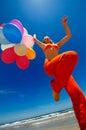 Young woman with colorful balloons