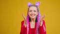 Young woman with colorful hair and afro braids demonstrate emotions, surprising