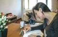 Young woman coloring mandalas