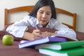 young woman concentrate reading book. education assessment concept. Student studying college exam, homework at university.